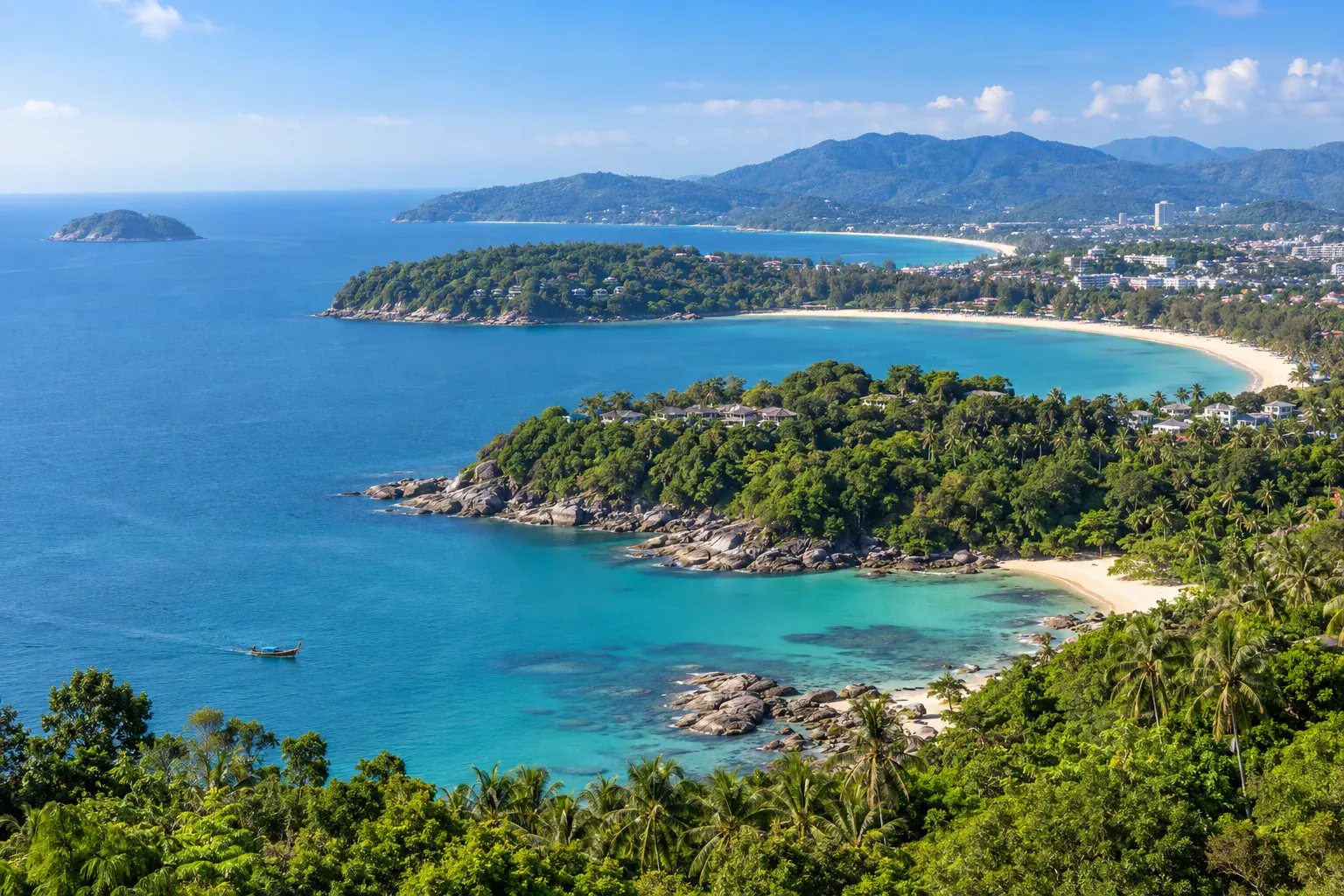 Panorama of Phuket west-coast bays, green headlands, and the Andaman Sea