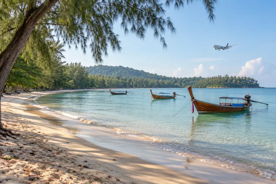 Nai Yang Beach, casuarina shade, local boats, and Sirinat National Park coast